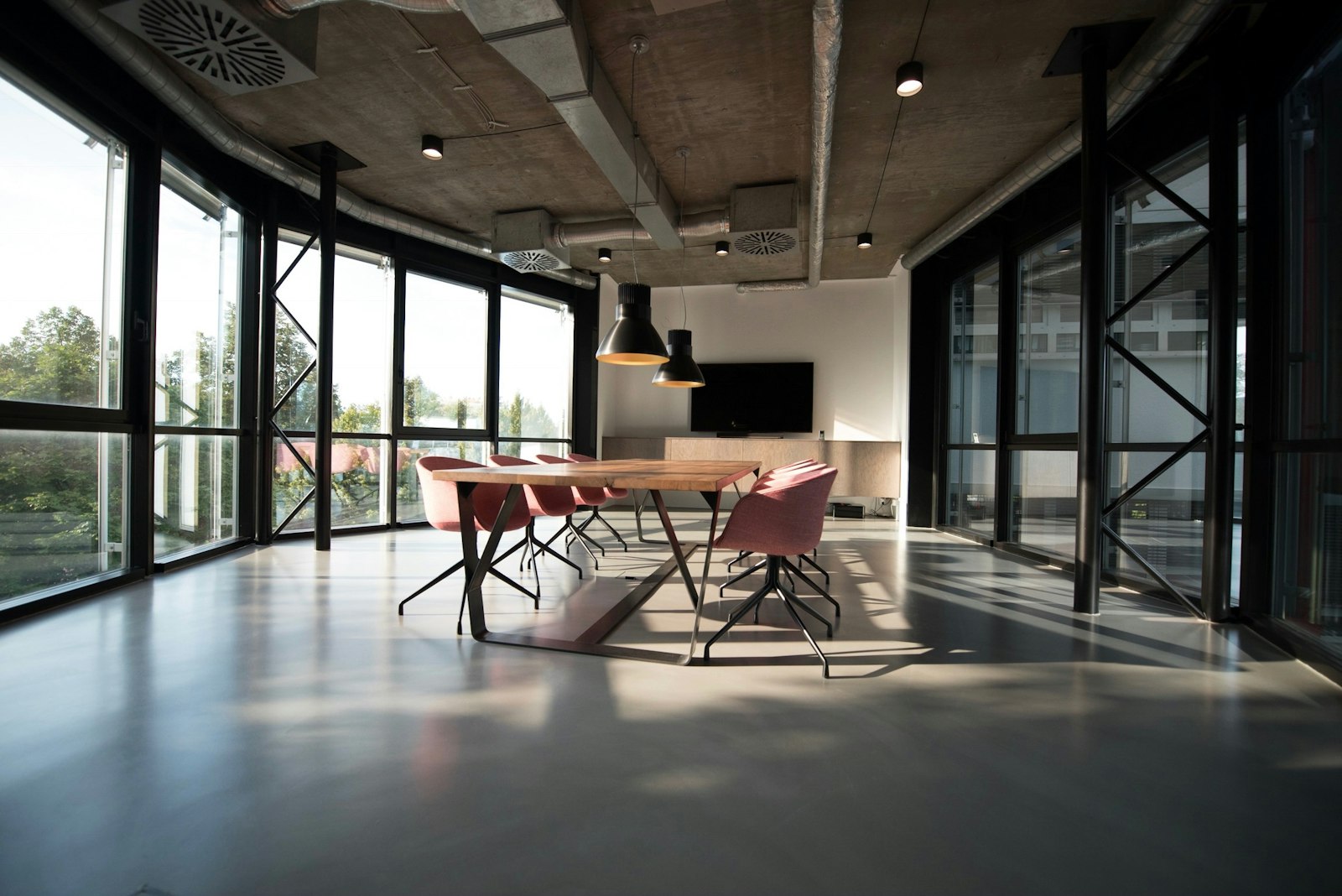 Bright office interior with wooden shelving and natural light